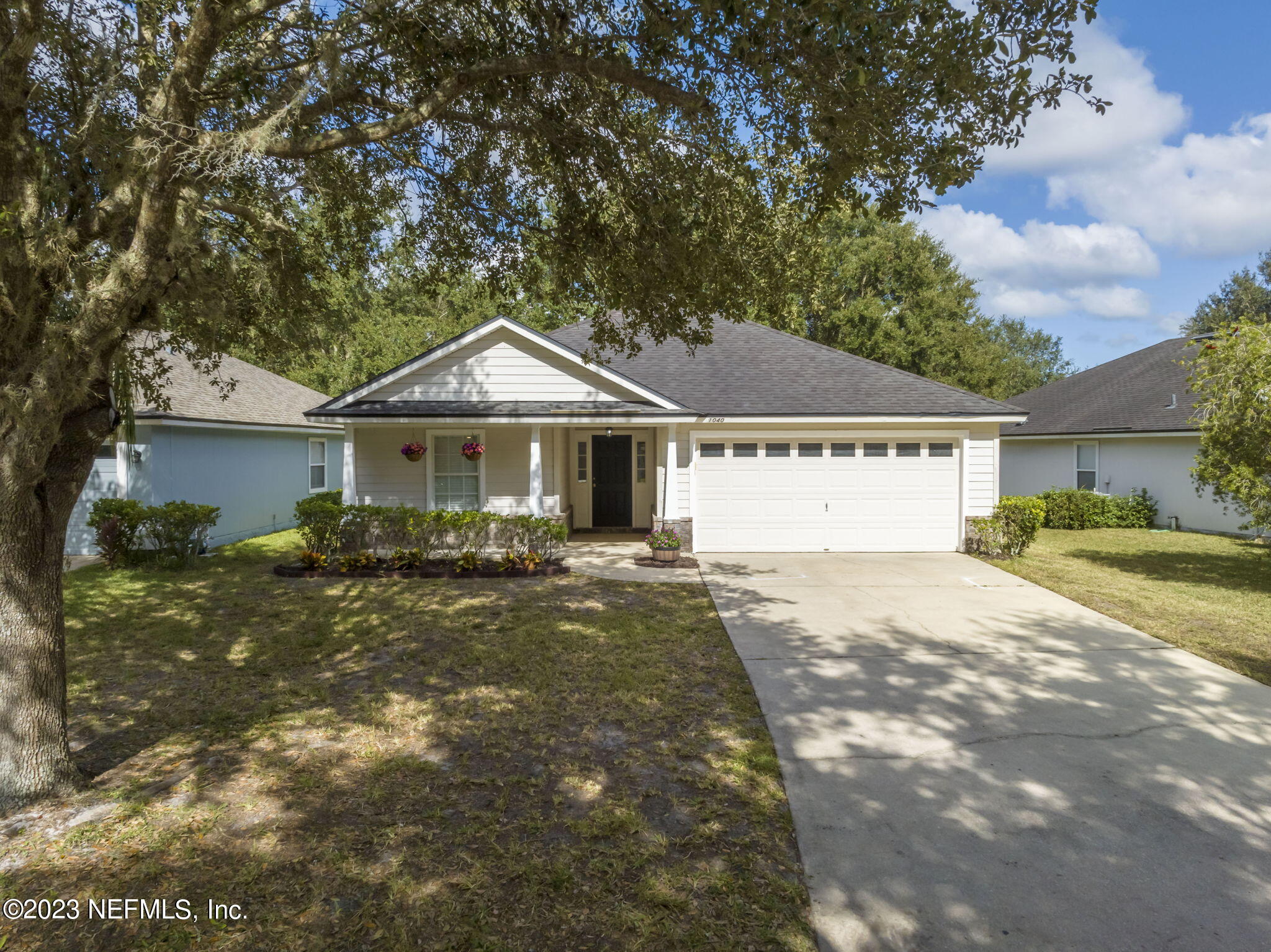 1040 Three Forks Court St. Augustine, FL 32092 - Photo 2 of 58 a front view of a house with a yard