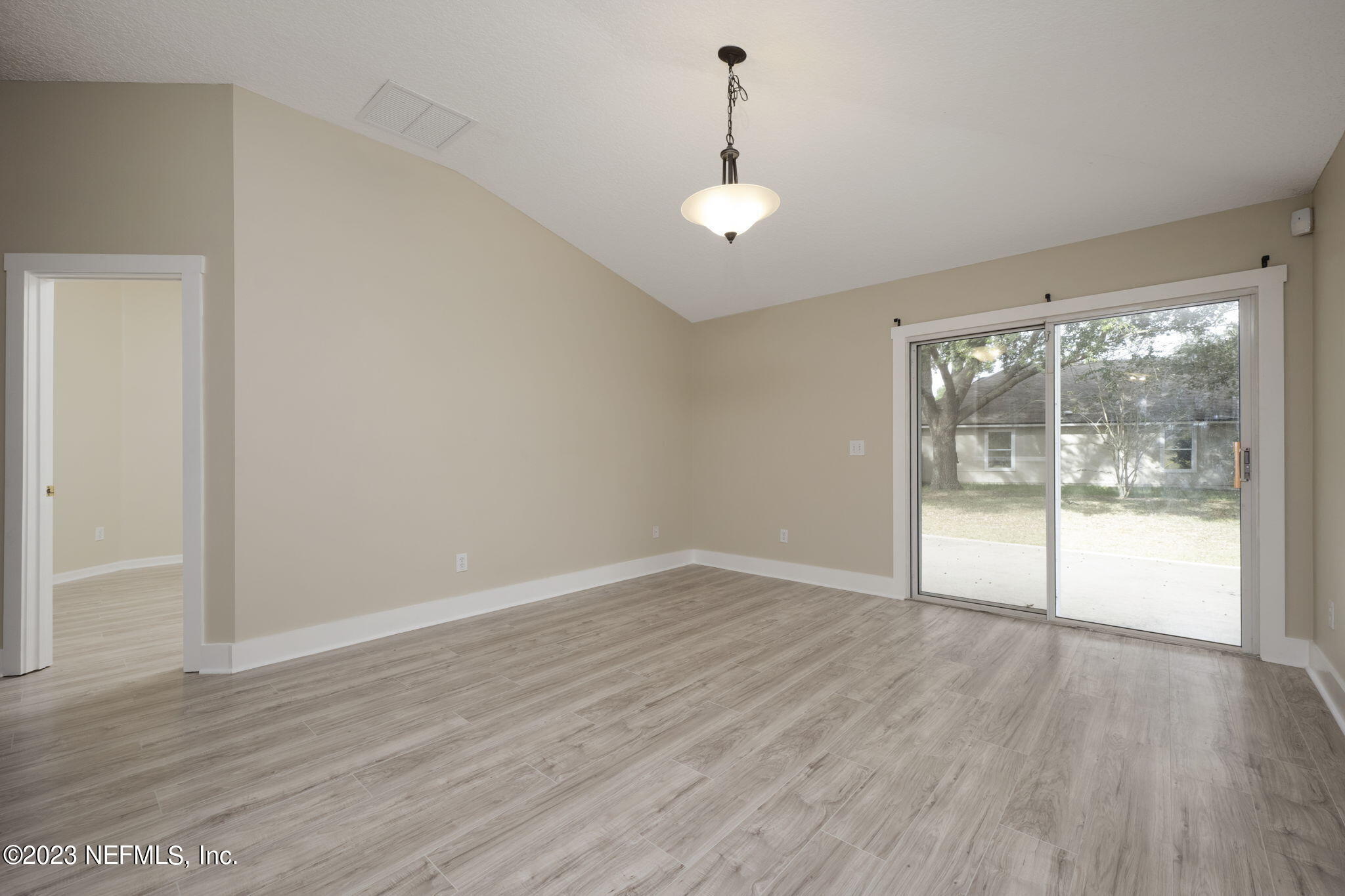 1040 Three Forks Court St. Augustine, FL 32092 - Photo 25 of 58 wooden floor in an empty room with a window
