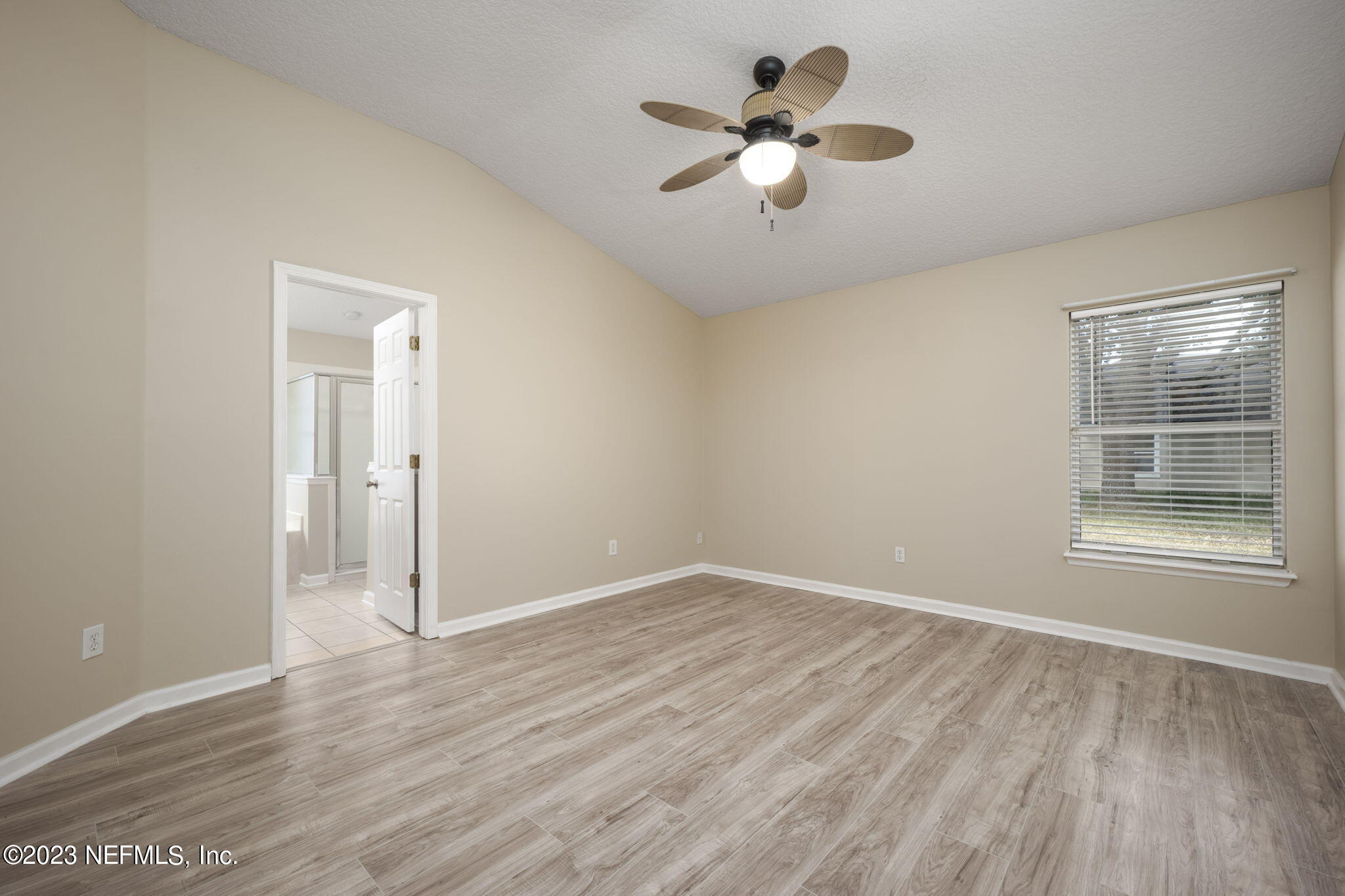 1040 Three Forks Court St. Augustine, FL 32092 - Photo 26 of 58 wooden floor in an empty room with a window