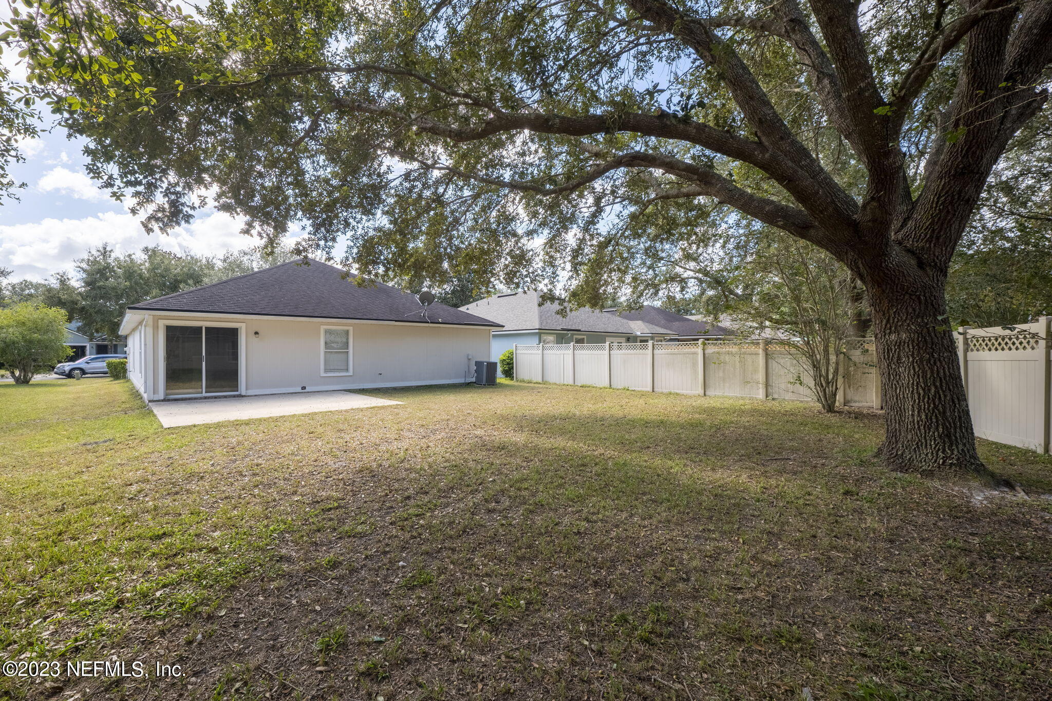 1040 Three Forks Court St. Augustine, FL 32092 - Photo 34 of 58 a front view of house with yard and trees