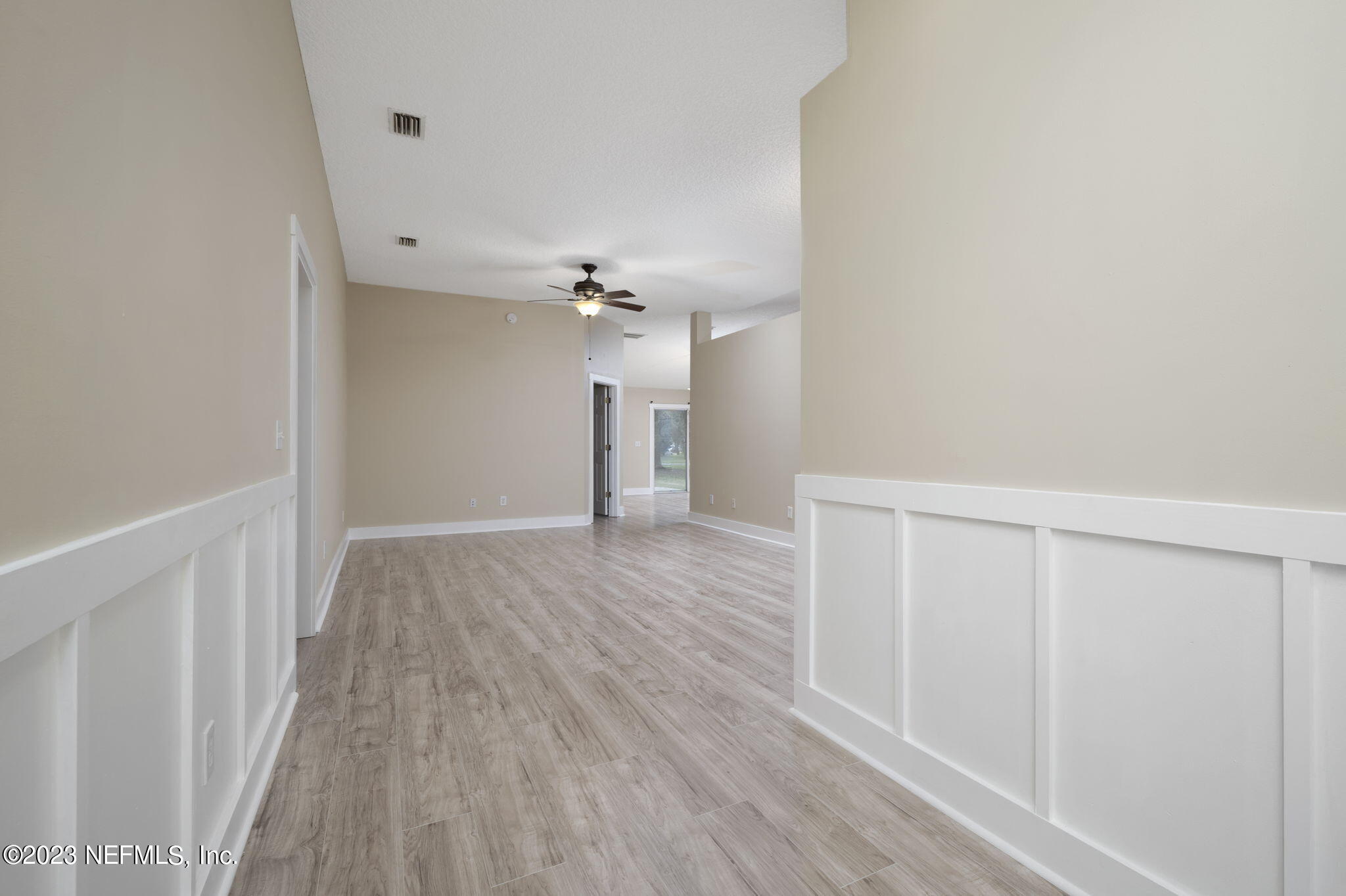 1040 Three Forks Court St. Augustine, FL 32092 - Photo 7 of 58 a view of an empty room with wooden floor