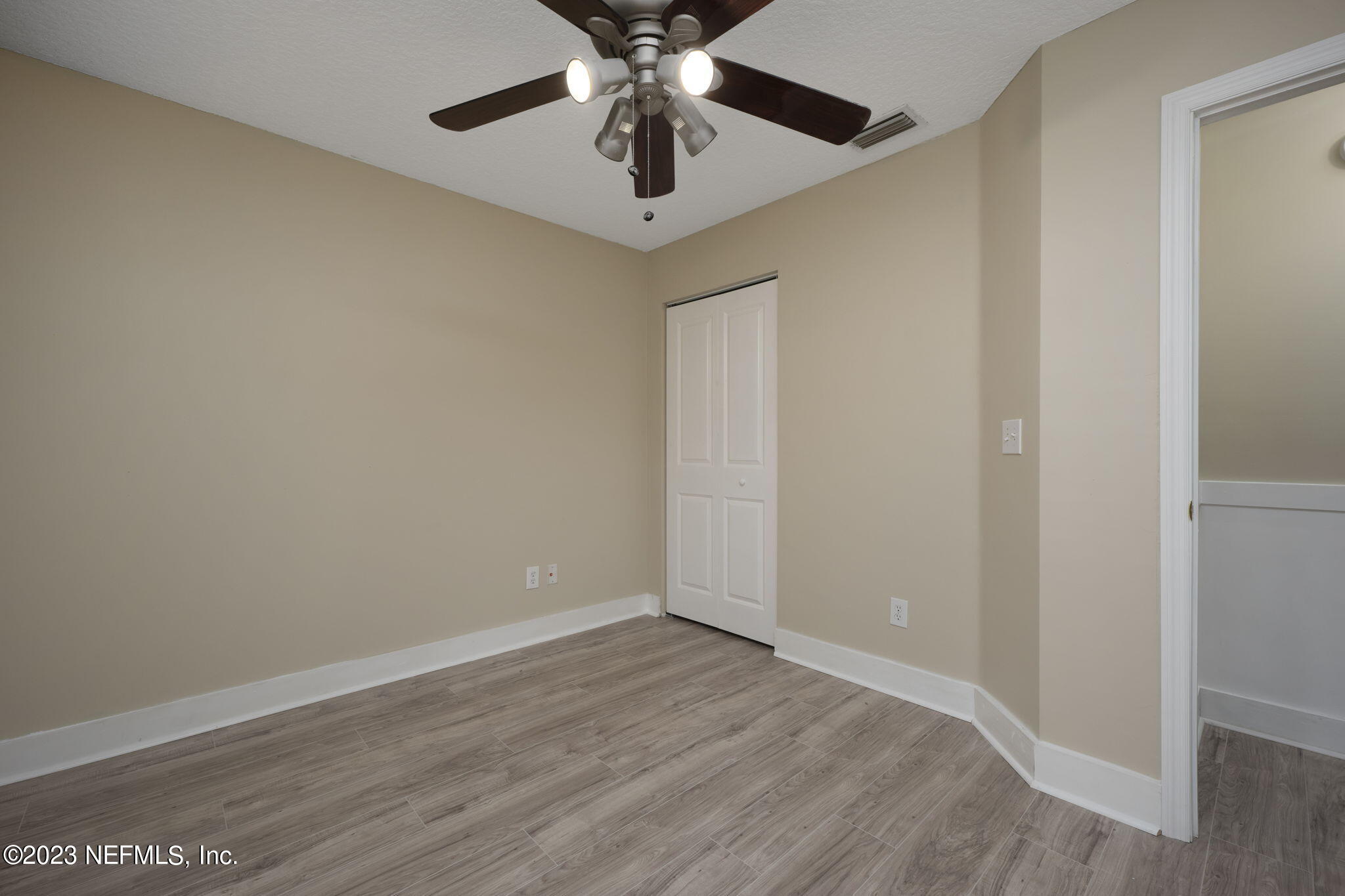 1040 Three Forks Court St. Augustine, FL 32092 - Photo 9 of 58 a view of an empty room with window and wooden floor