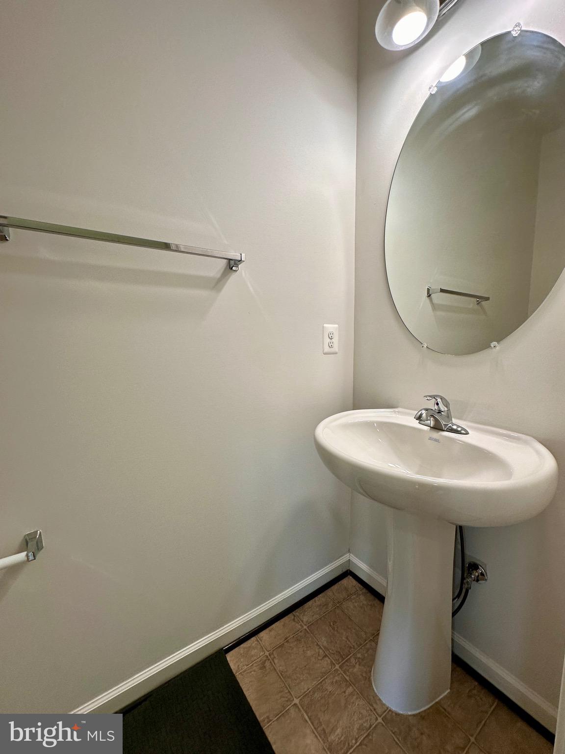 111 Fading Star Court Stephenson, VA 22656 - Photo 4 of 25 a bathroom with a sink and mirror