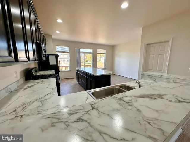 a view of a large room with furniture and a rug