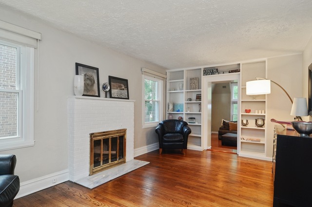 2138 Illinois Road Northbrook, IL 60062 - Photo 2 of 15 a living room with furniture wooden floor and a fireplace