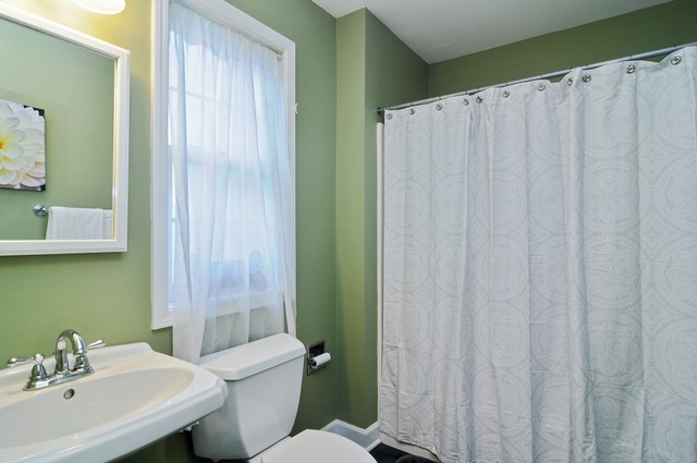 2138 Illinois Road Northbrook, IL 60062 - Photo 13 of 15 a bathroom with a sink a toilet and shower