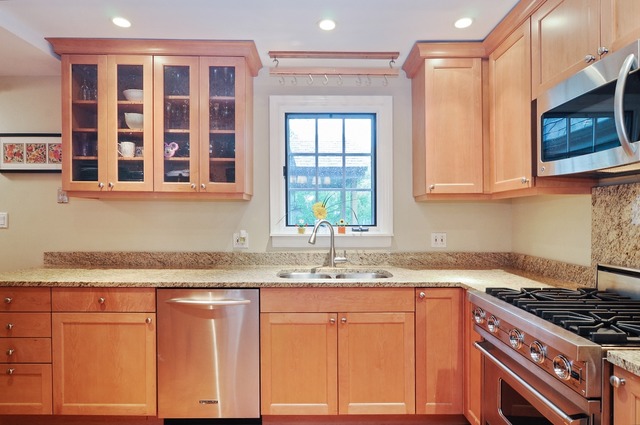 2138 Illinois Road Northbrook, IL 60062 - Photo 6 of 15 a kitchen with granite countertop cabinets stainless steel appliances a sink and a window