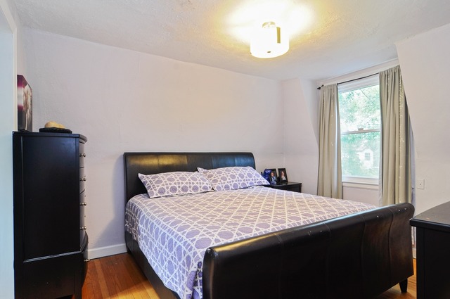 2138 Illinois Road Northbrook, IL 60062 - Photo 10 of 15 a bedroom with a bed and wooden floor