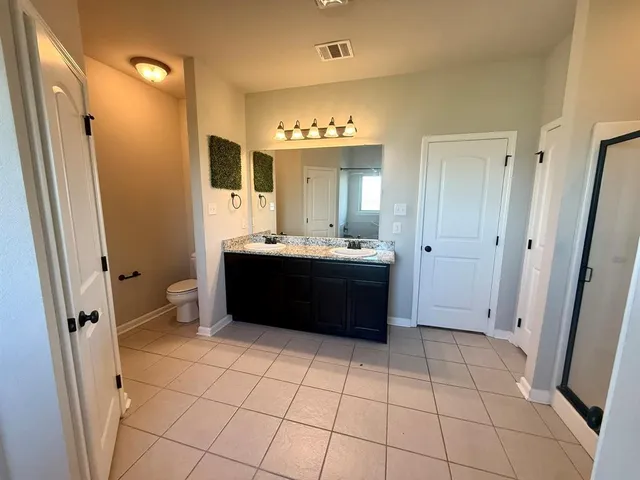 a bathroom with a sink a mirror and a toilet