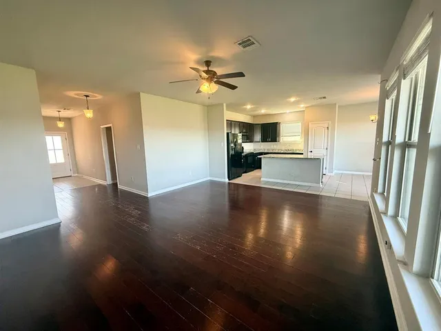 a view of a kitchen with a sink and a stove top oven