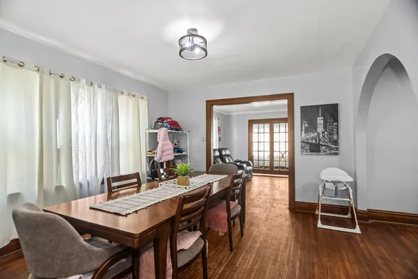 a view of a dining room with furniture and wooden floor