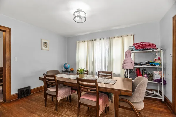 a dining room with furniture and window