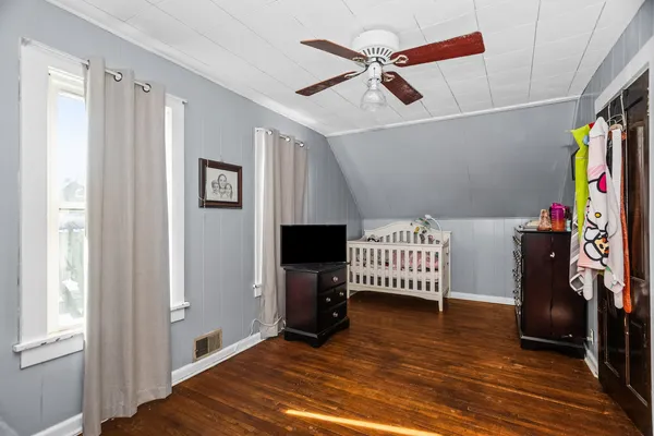a view of an entryway with wooden floor