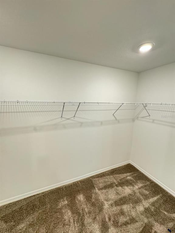 724 Reggie Road Winter Haven, FL 33859 - Photo 14 of 26 a view of a room with racks on the wall