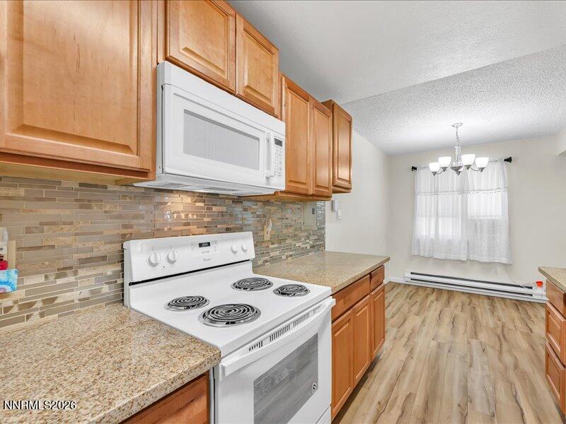 820 Jamaica Avenue, Unit 3 Reno, NV 89502 - Photo 12 of 19 a kitchen with a sink stove and cabinets