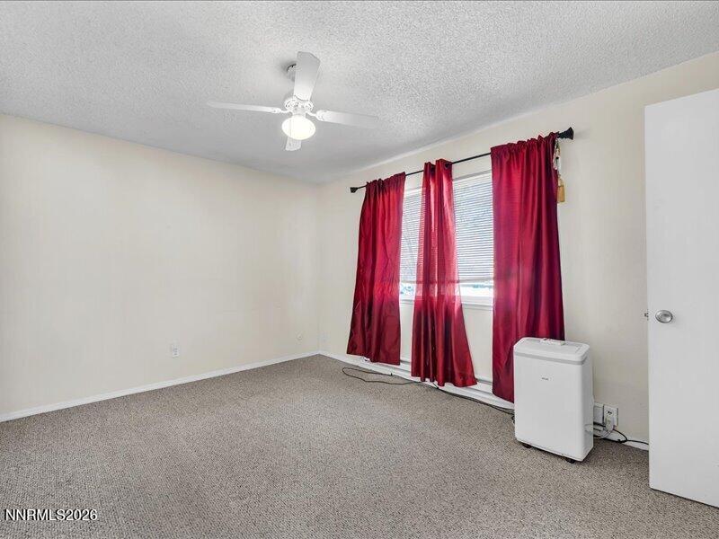 820 Jamaica Avenue, Unit 3 Reno, NV 89502 - Photo 15 of 19 a view of a room with window and couch