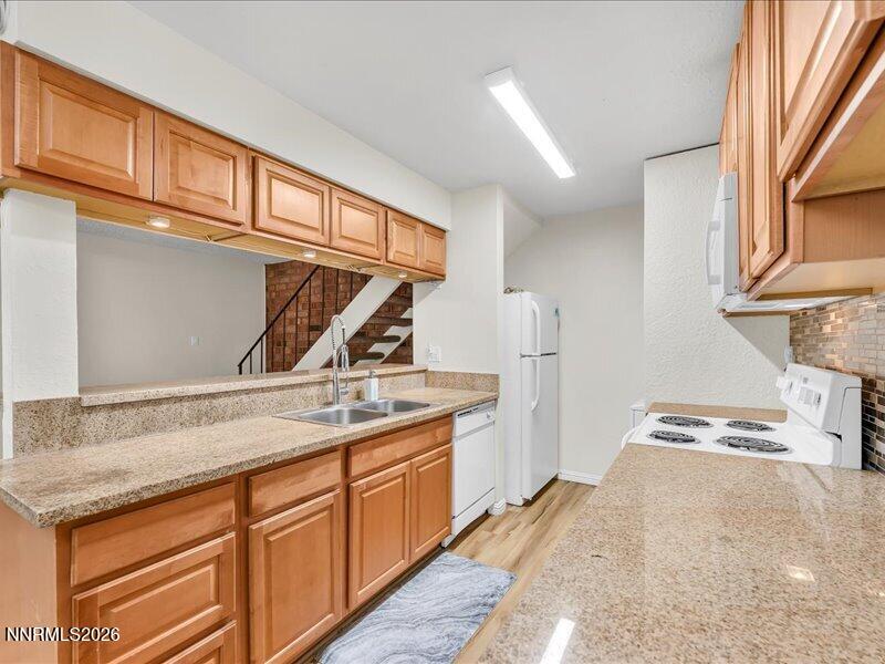 820 Jamaica Avenue, Unit 3 Reno, NV 89502 - Photo 10 of 19 a kitchen with a sink a stove and cabinets