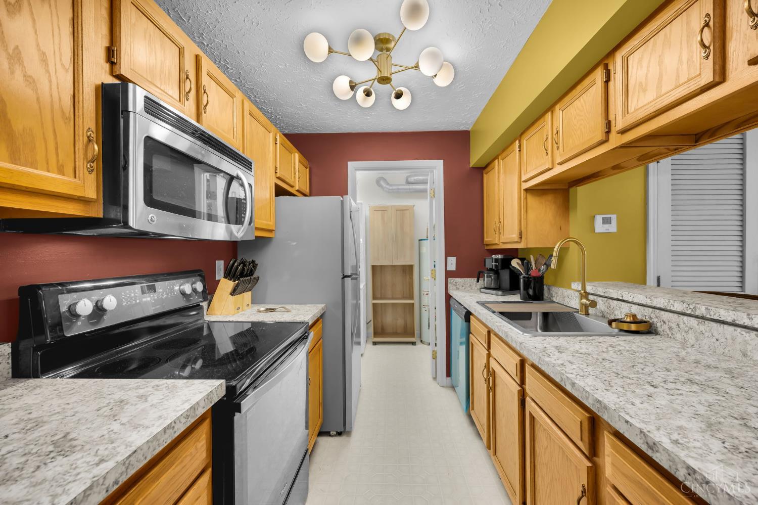 3543 Jessup Road, Unit 2B Cincinnati, OH 45239 - Photo 8 of 31 Bright kitchen featuring generous cabinetry, countertop workspace, and appliance package