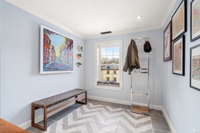 a view of a room with window and wooden floor