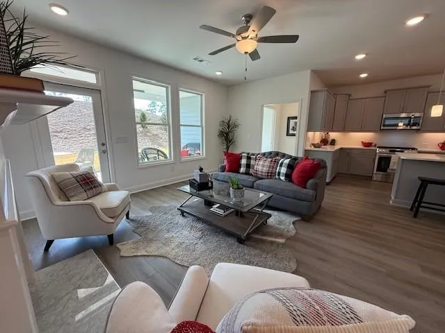 a kitchen with stainless steel appliances granite countertop a sink and a stove