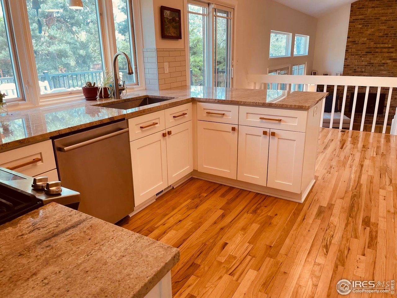 4303 30th Street Boulder, CO 80301 - Photo 13 of 37 a kitchen with a sink and large window