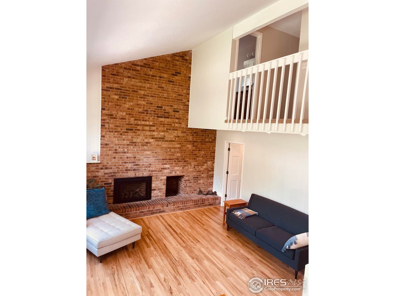4303 30th Street Boulder, CO 80301 - Photo 17 of 37 a living room with furniture and a fireplace