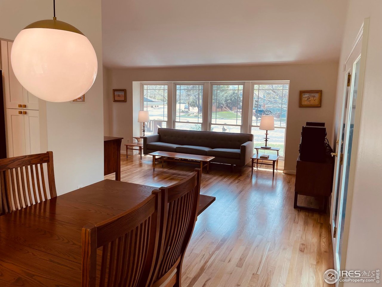 4303 30th Street Boulder, CO 80301 - Photo 18 of 37 a view of a dining room with furniture window and wooden floor