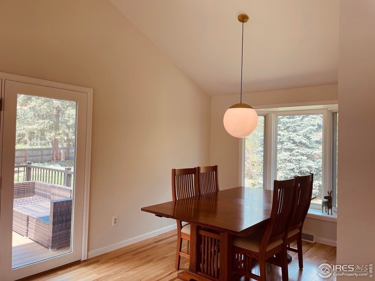 4303 30th Street Boulder, CO 80301 - Photo 20 of 37 a view of a dining room with furniture window and wooden floor
