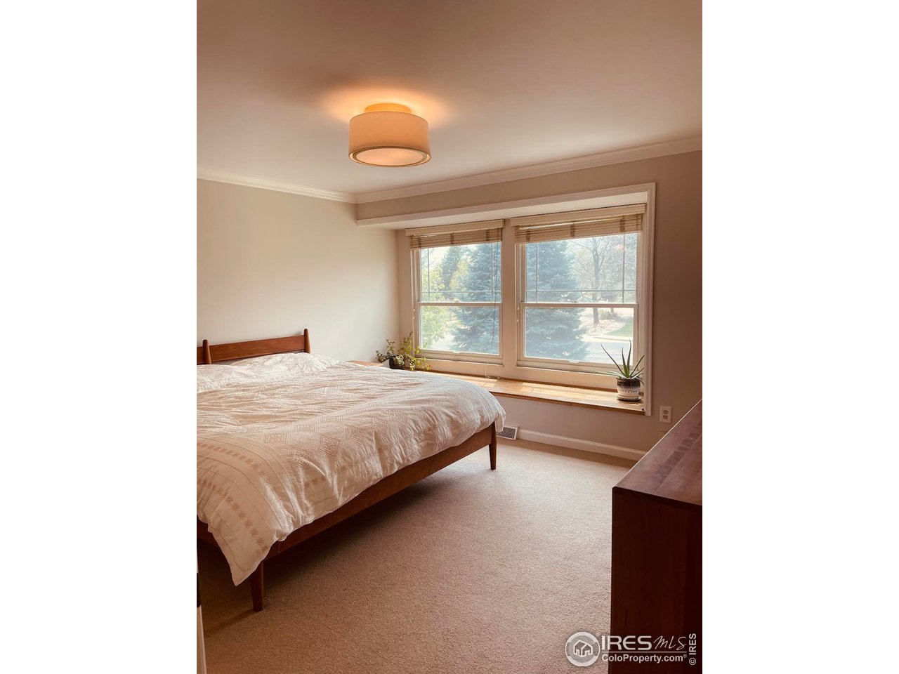 4303 30th Street Boulder, CO 80301 - Photo 22 of 37 a bedroom with a bed and a window