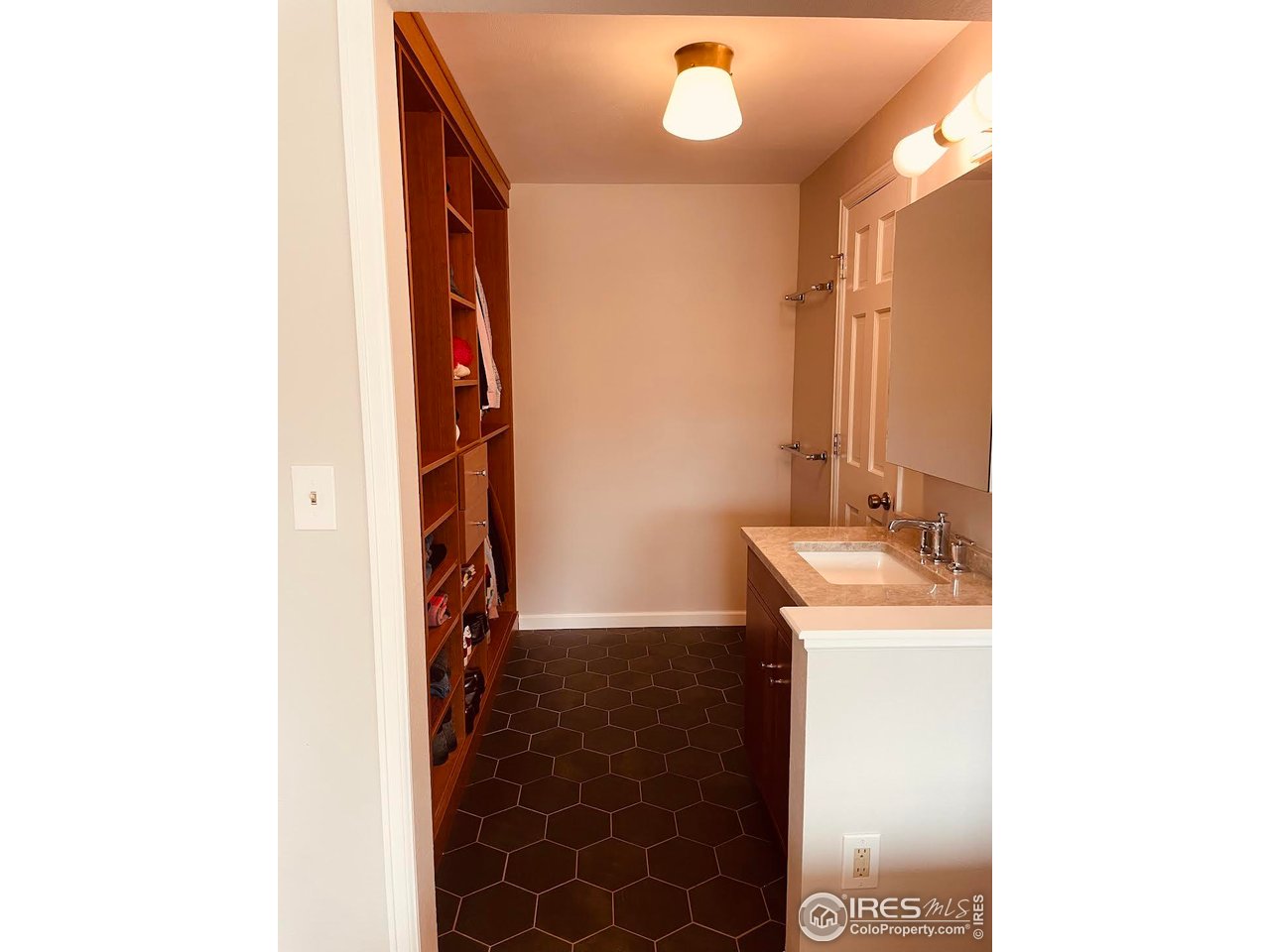 4303 30th Street Boulder, CO 80301 - Photo 23 of 37 a bathroom with a sink and a mirror