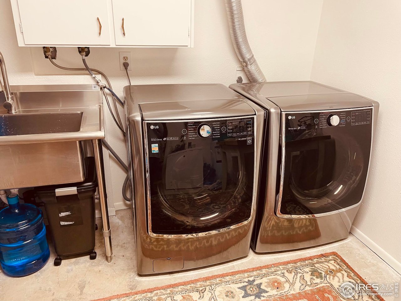 4303 30th Street Boulder, CO 80301 - Photo 37 of 37 a utility room with a washer and dryer