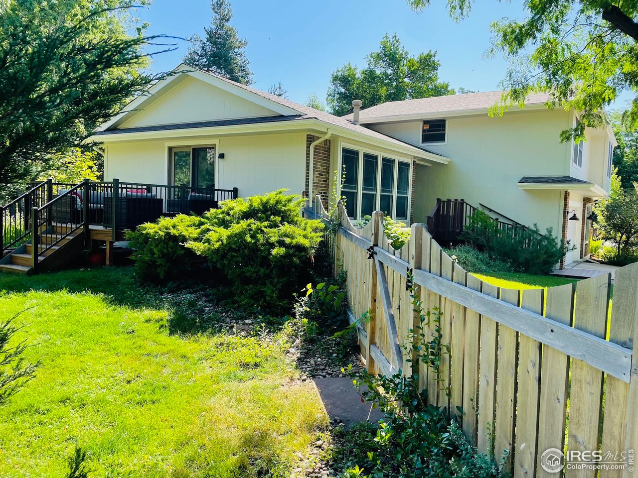 4303 30th Street Boulder, CO 80301 - Photo 4 of 37 a front view of house with yard and green space