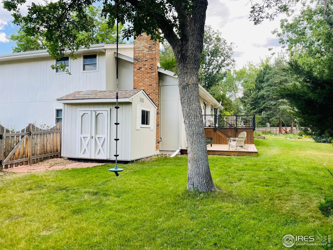 4303 30th Street Boulder, CO 80301 - Photo 10 of 37 a view of a house with backyard and a tree