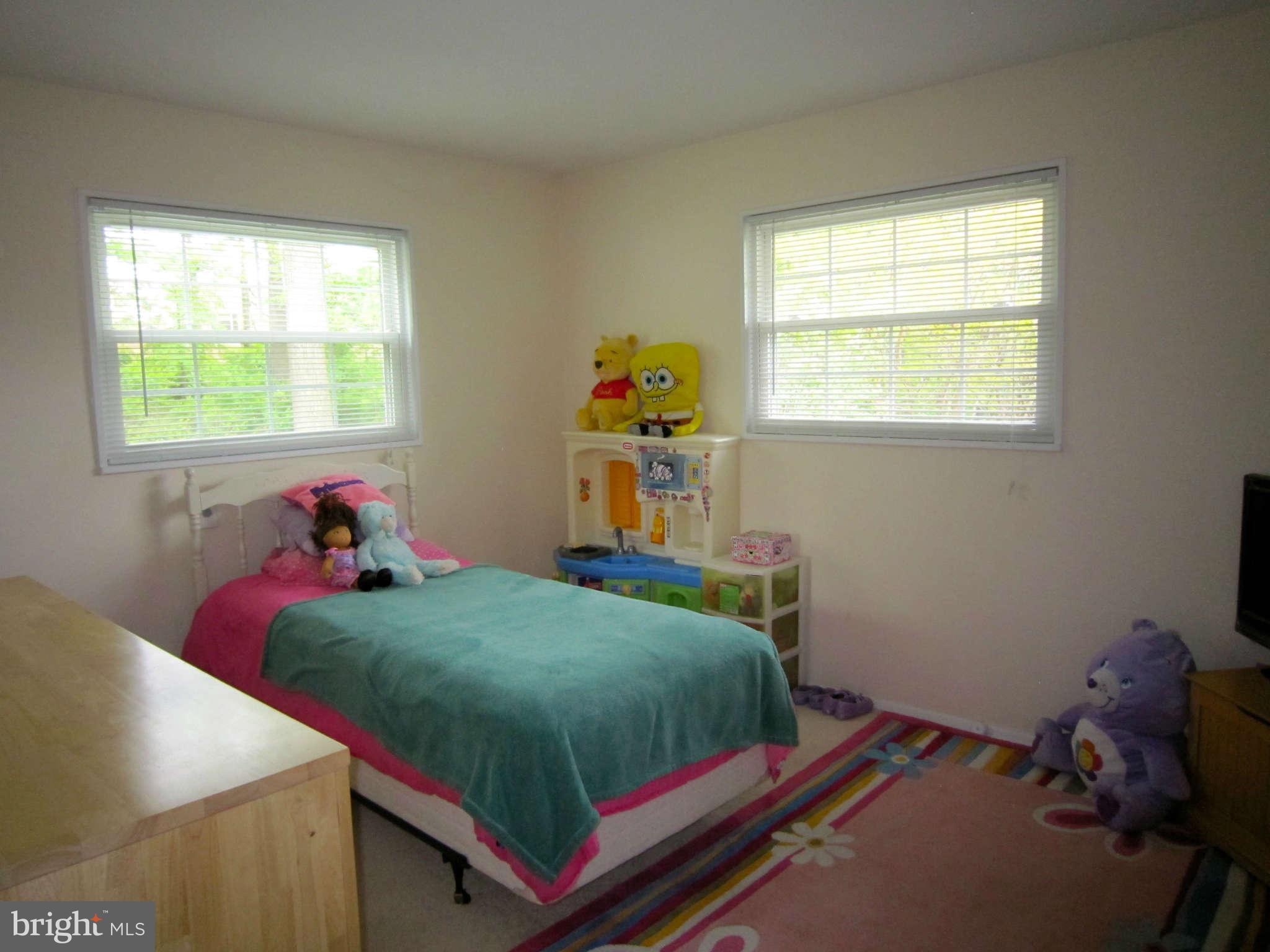 4310 Emden Street Silver Spring, MD 20906 - Photo 14 of 21 a bedroom with a bed and a window