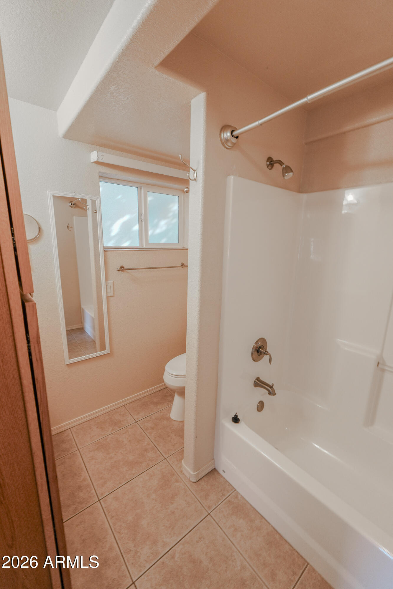 17200 West Bell Road, Unit 1806 Surprise, AZ 85374 - Photo 11 of 23 a bathroom with a bathtub a toilet and a shower