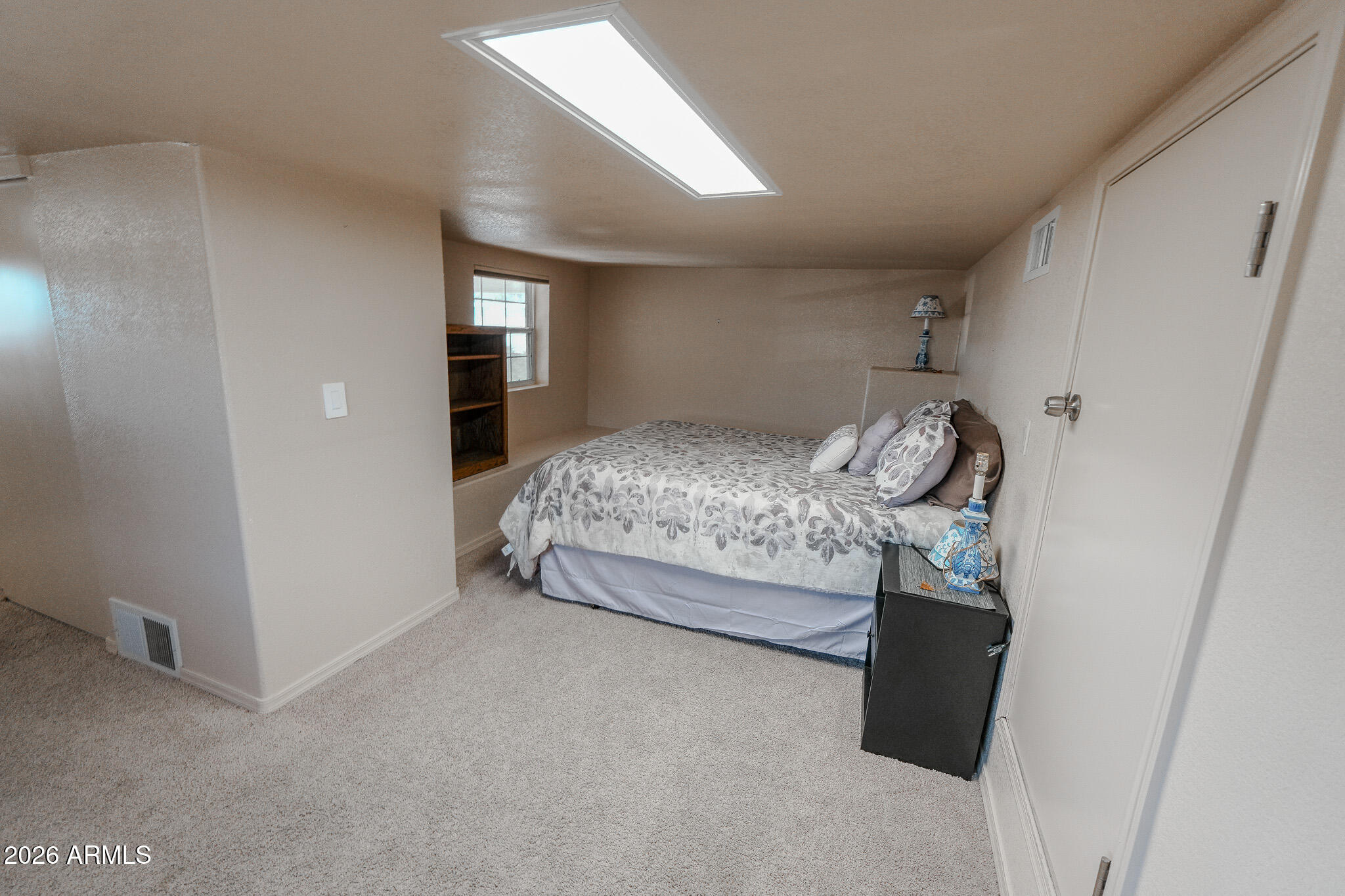 17200 West Bell Road, Unit 1806 Surprise, AZ 85374 - Photo 18 of 23 a bed room with a bed and a window