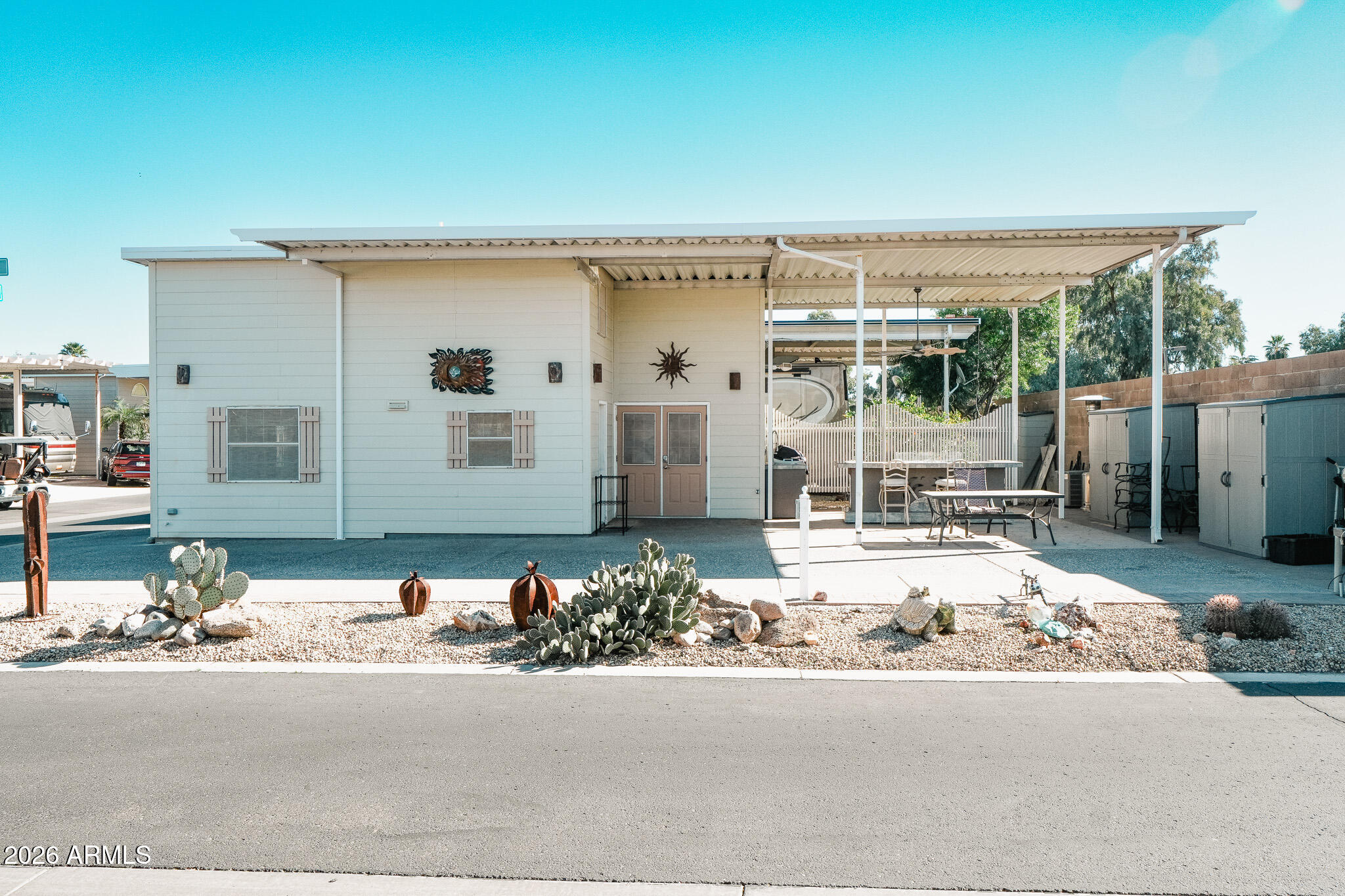 17200 West Bell Road, Unit 1806 Surprise, AZ 85374 - Photo 21 of 23 a front view of a house with a yard