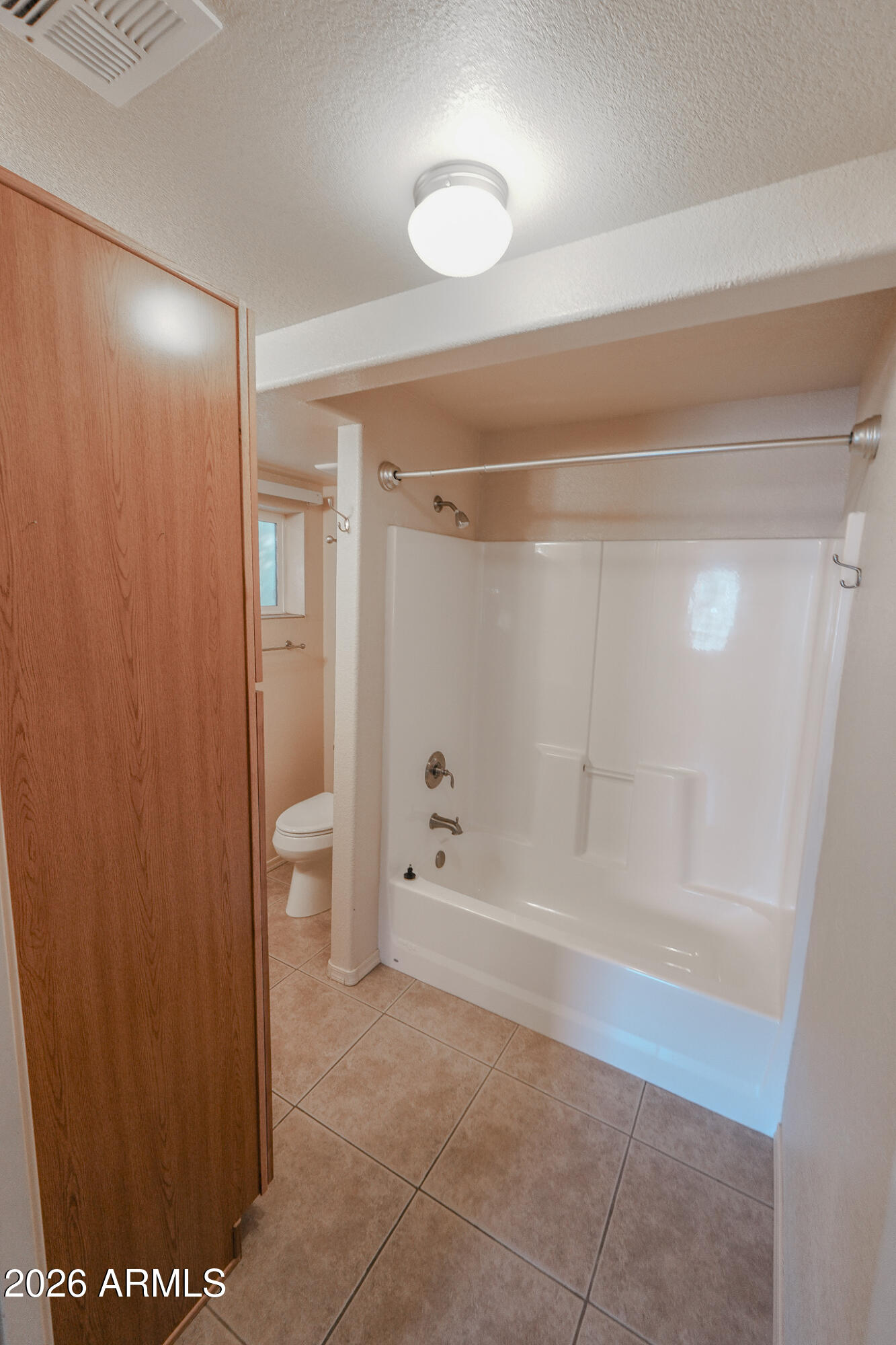 17200 West Bell Road, Unit 1806 Surprise, AZ 85374 - Photo 10 of 23 a bathroom with a bathtub and a shower