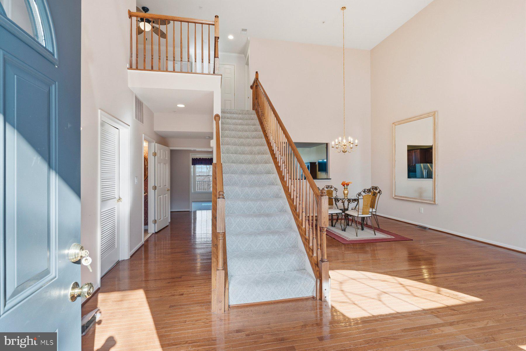 8330 Meadowsweet Road, Unit 8330 Pikesville, MD 21208 - Photo 2 of 55 a view of entryway and hall with wooden floor