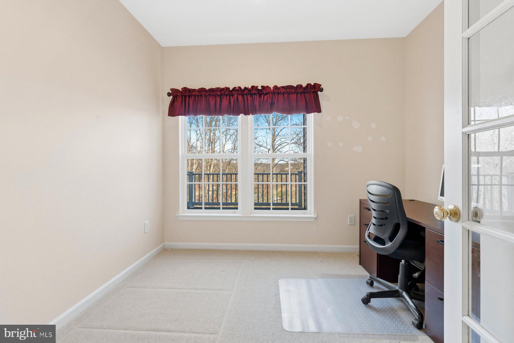 8330 Meadowsweet Road, Unit 8330 Pikesville, MD 21208 - Photo 19 of 55 a workspace with furniture and a window