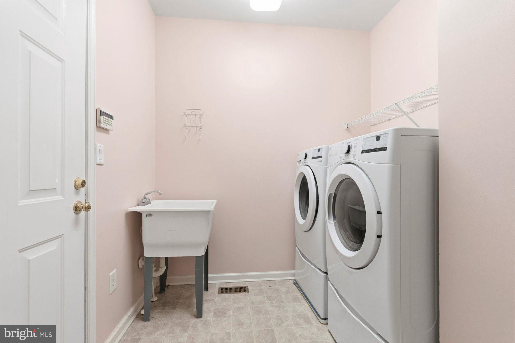 8330 Meadowsweet Road, Unit 8330 Pikesville, MD 21208 - Photo 22 of 55 a utility room with dryer and washer
