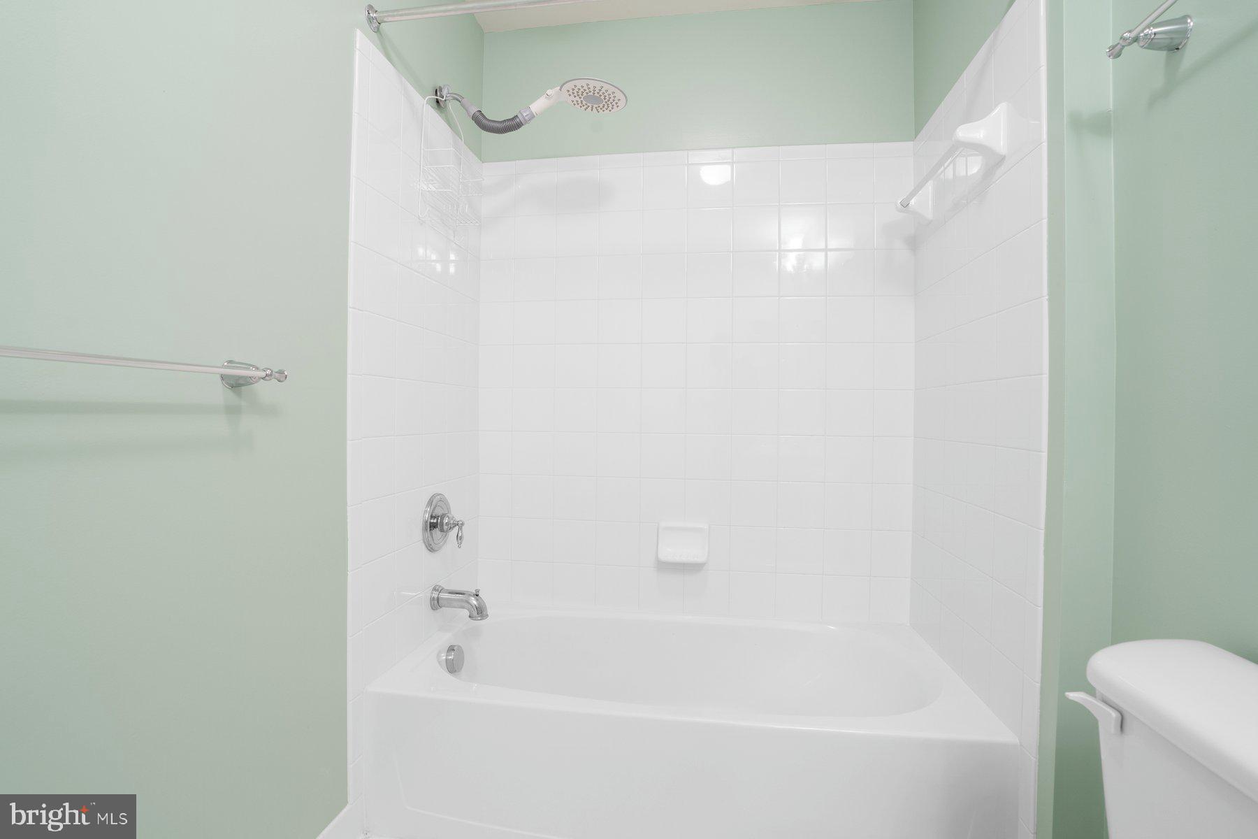 8330 Meadowsweet Road, Unit 8330 Pikesville, MD 21208 - Photo 27 of 55 a bathroom with a bathtub and a shower