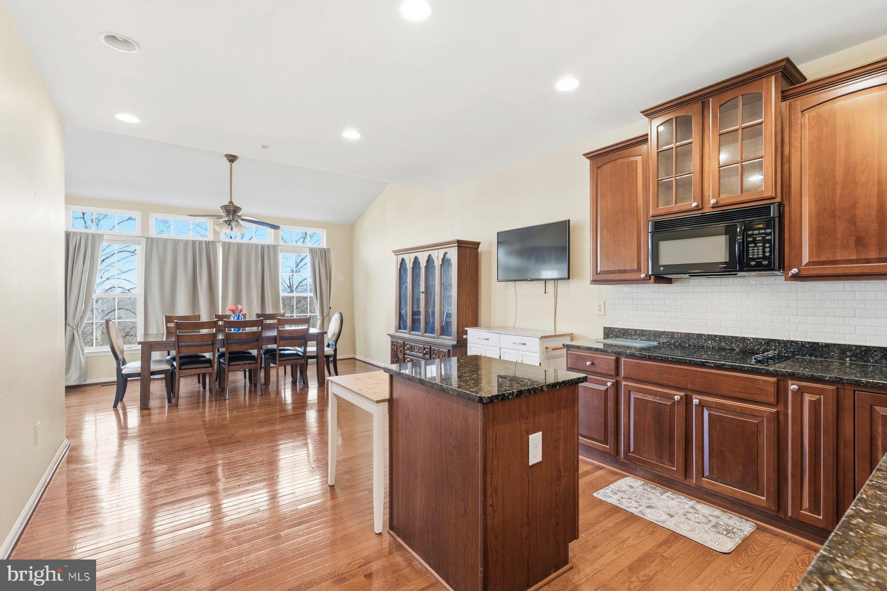8330 Meadowsweet Road, Unit 8330 Pikesville, MD 21208 - Photo 53 of 55 a kitchen with lots of counter top space and dining table