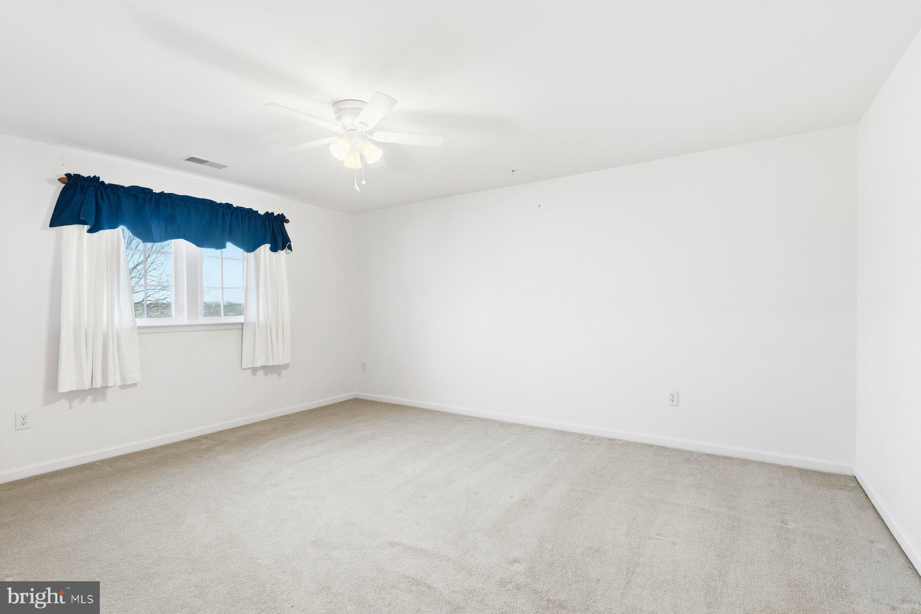 8330 Meadowsweet Road, Unit 8330 Pikesville, MD 21208 - Photo 29 of 55 an empty room with a window