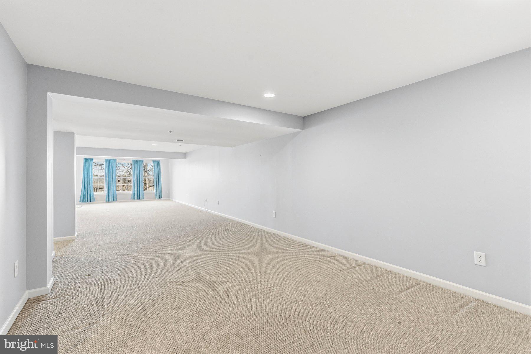 8330 Meadowsweet Road, Unit 8330 Pikesville, MD 21208 - Photo 33 of 55 a view of an empty room with a window