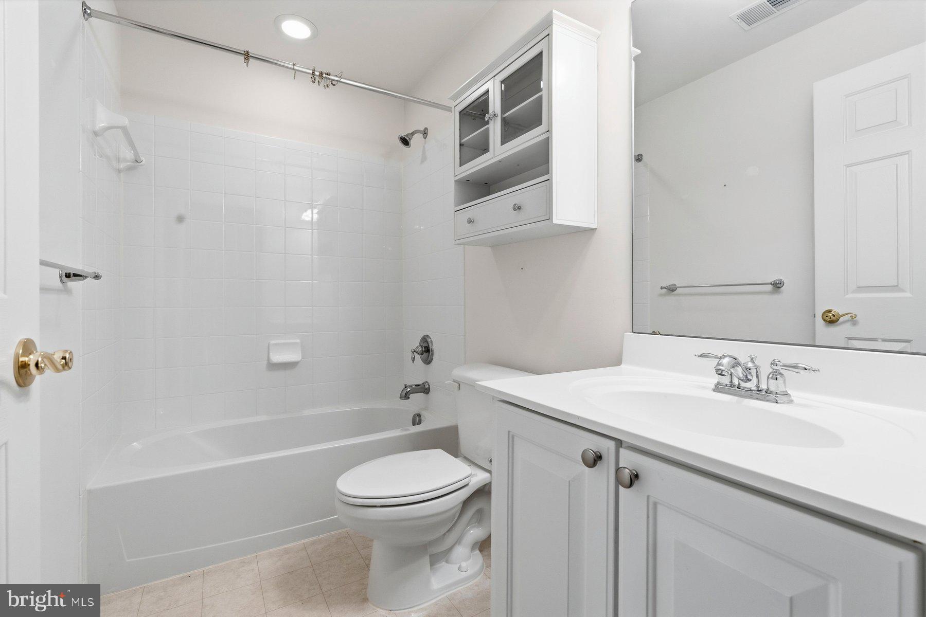 8330 Meadowsweet Road, Unit 8330 Pikesville, MD 21208 - Photo 34 of 55 a bathroom with a sink a toilet and shower