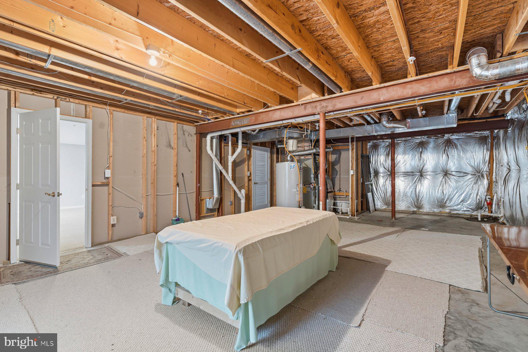 8330 Meadowsweet Road, Unit 8330 Pikesville, MD 21208 - Photo 38 of 55 a bed room with a bed and a mirror