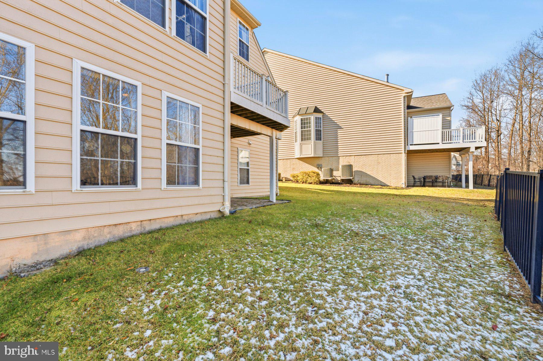 8330 Meadowsweet Road, Unit 8330 Pikesville, MD 21208 - Photo 43 of 55 a front view of a house with a yard