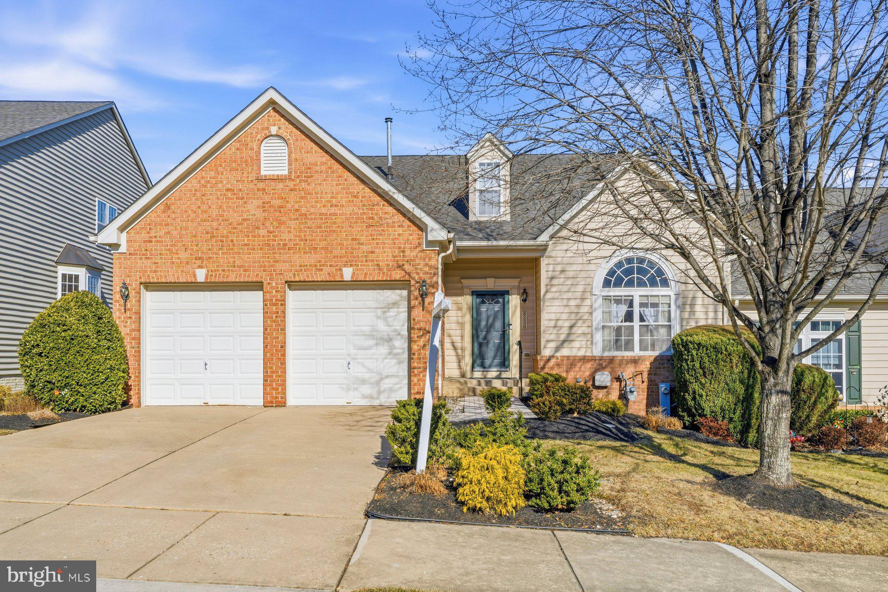 8330 Meadowsweet Road, Unit 8330 Pikesville, MD 21208 - Photo 47 of 55 a front view of a house with garden