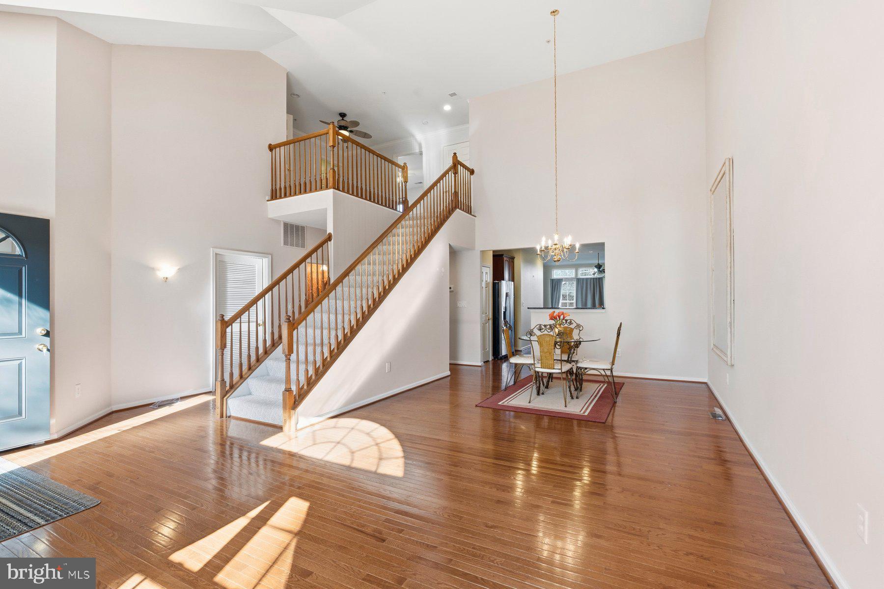 8330 Meadowsweet Road, Unit 8330 Pikesville, MD 21208 - Photo 4 of 55 a view of a livingroom with wooden floor and a hallway
